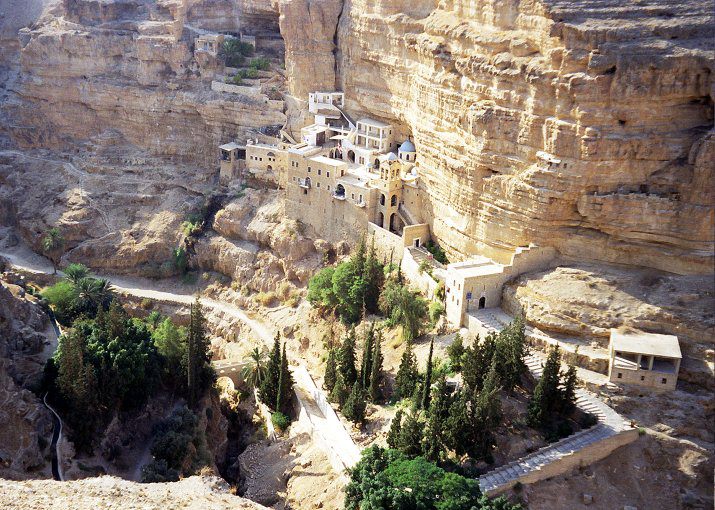 The Monastery of St. George of Choziba, shown here, is a few kilometers from Jericho along the valley known as Wadi Kelt. The Monastery is open to visitors and is richly decorated and quite serene. It is buit at the cave in which Elias was said to have wanted to perish but was fed by a raven who brought him food.